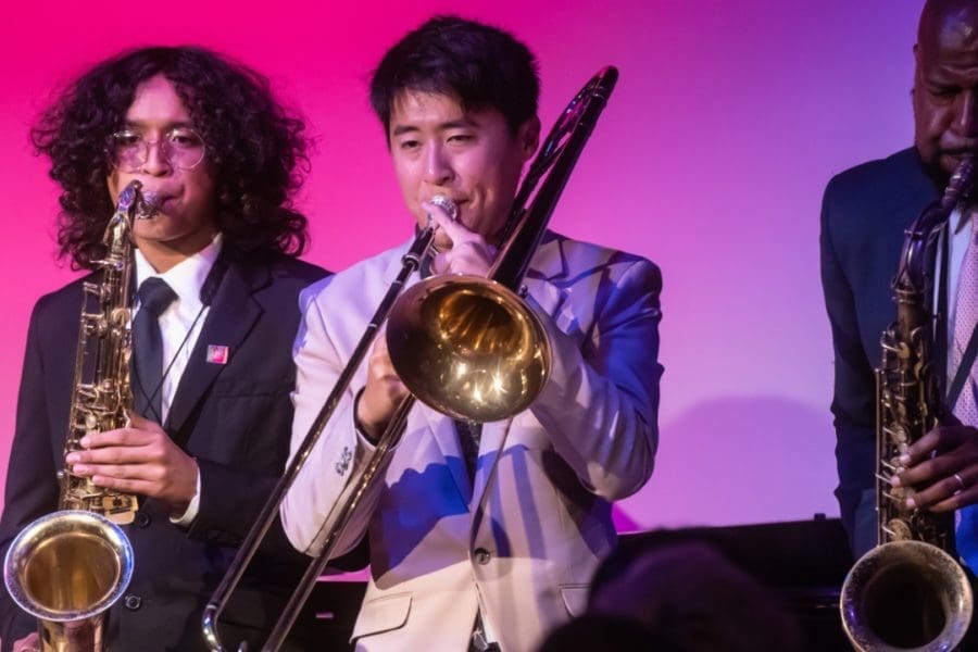teenager kids playing trumpets